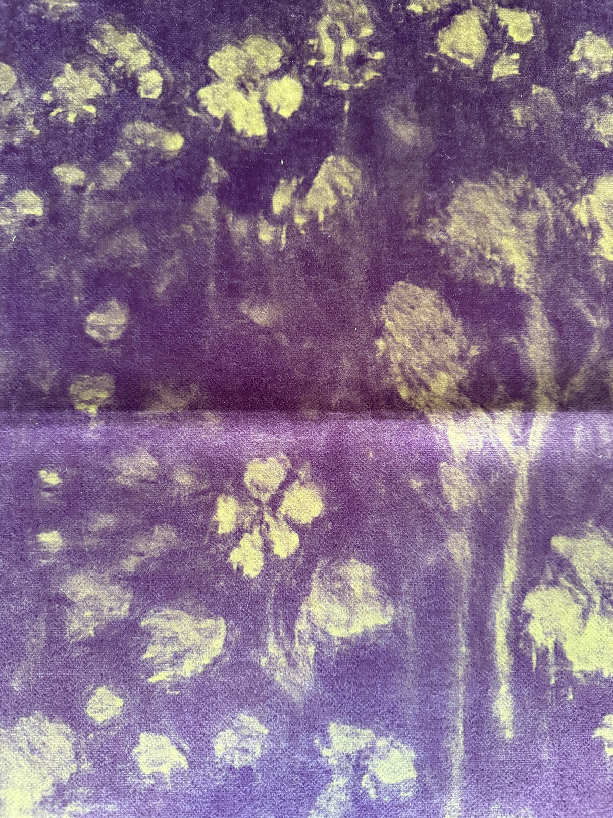 Textured fabric with floral pattern in merlot and green