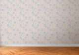 Floral patterned wallpaper with a wooden floor at the bottom