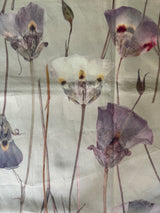 Pattern of wilted flowers on a textured fabric background