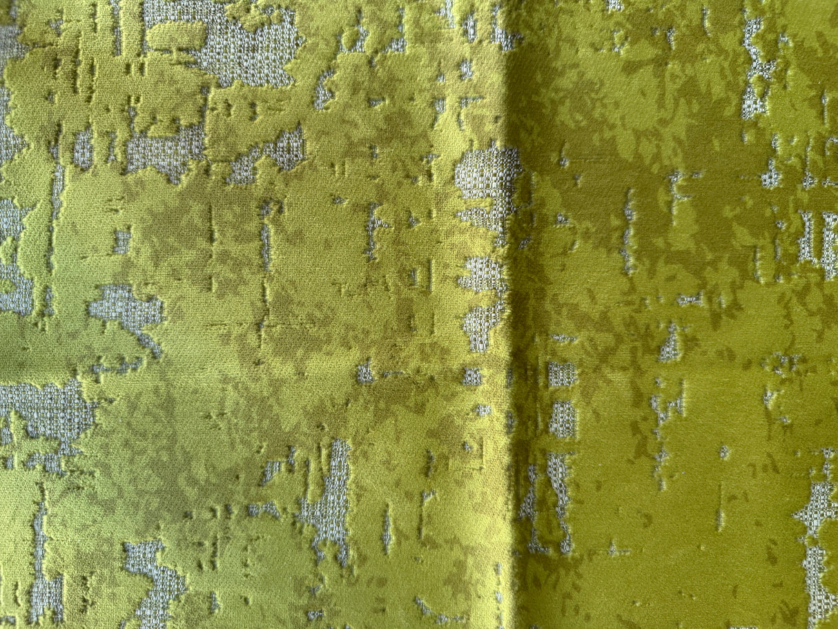 Close-up of green textured fabric with a subtle pattern