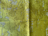 Close-up of green textured fabric with a subtle pattern