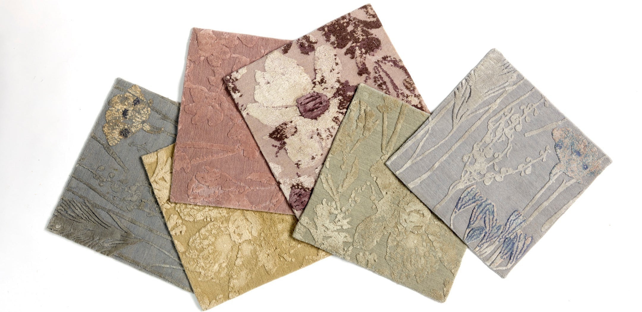 Six square fabric swatches with textured, embossed patterns in muted tones of gray, green, pink, gold, and brown, arranged in a fan shape on a white background.