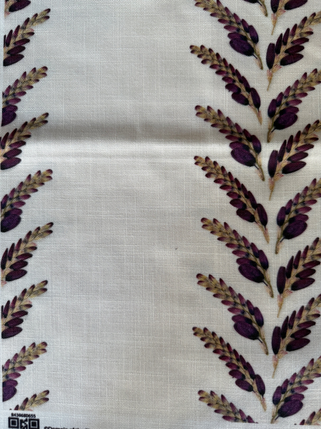 Fabric with purple leaf pattern on a white background