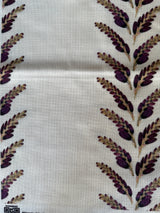 Fabric with purple leaf pattern on a white background
